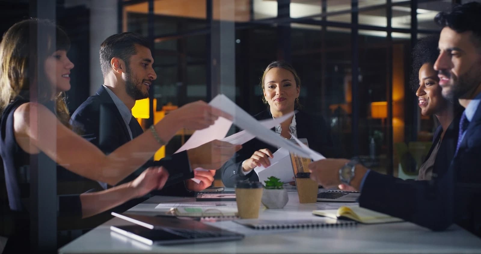 Law firm team reviewing client documents in a meeting