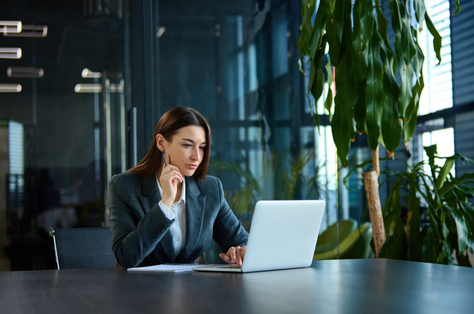 Mortgage adviser reviewing a client's financial position on a laptop